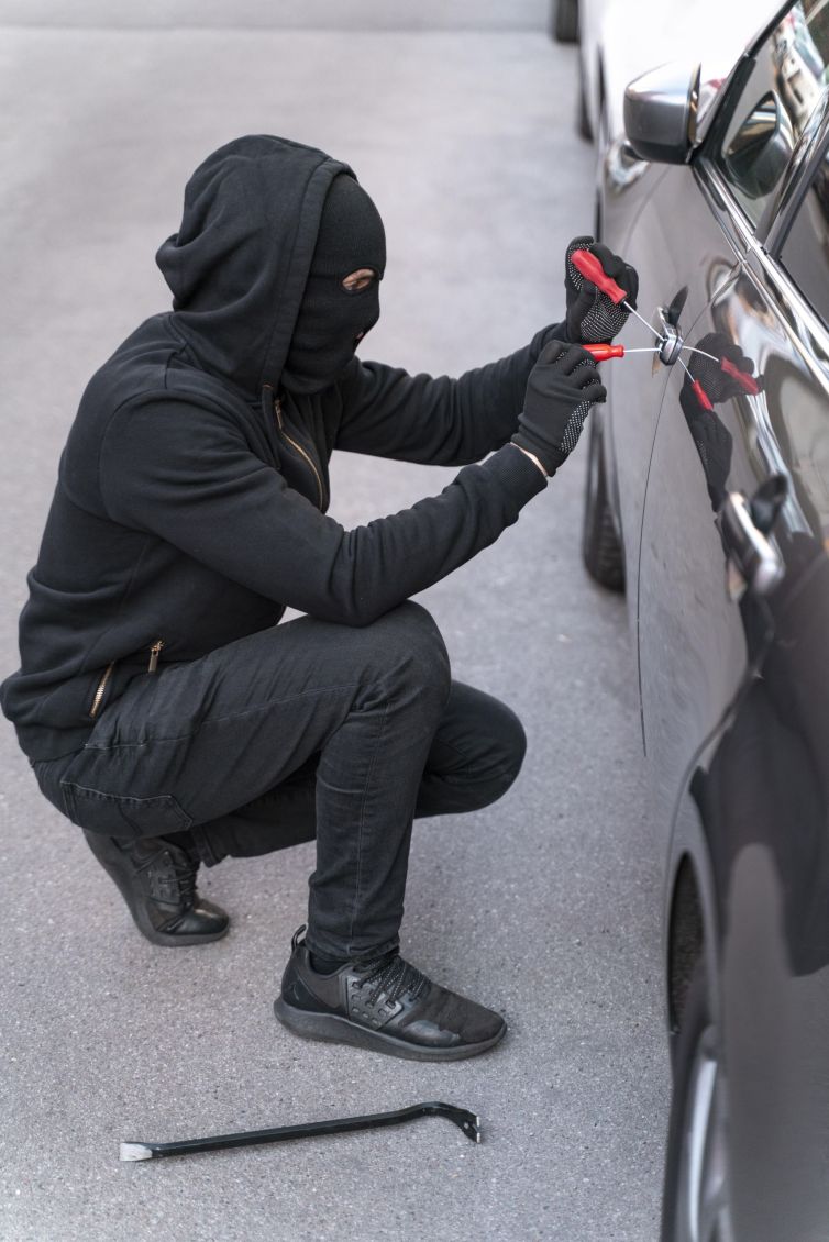 close-up-man-trying-break-into-car