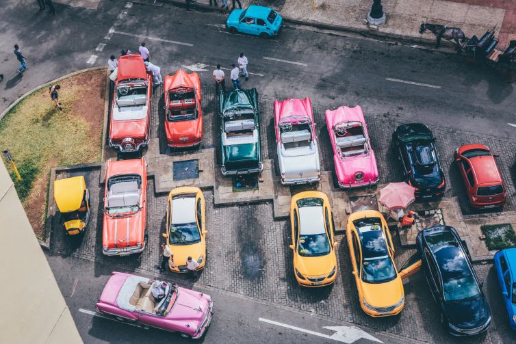 overhead-shot-assorted-cars-different-colors-parking-lot